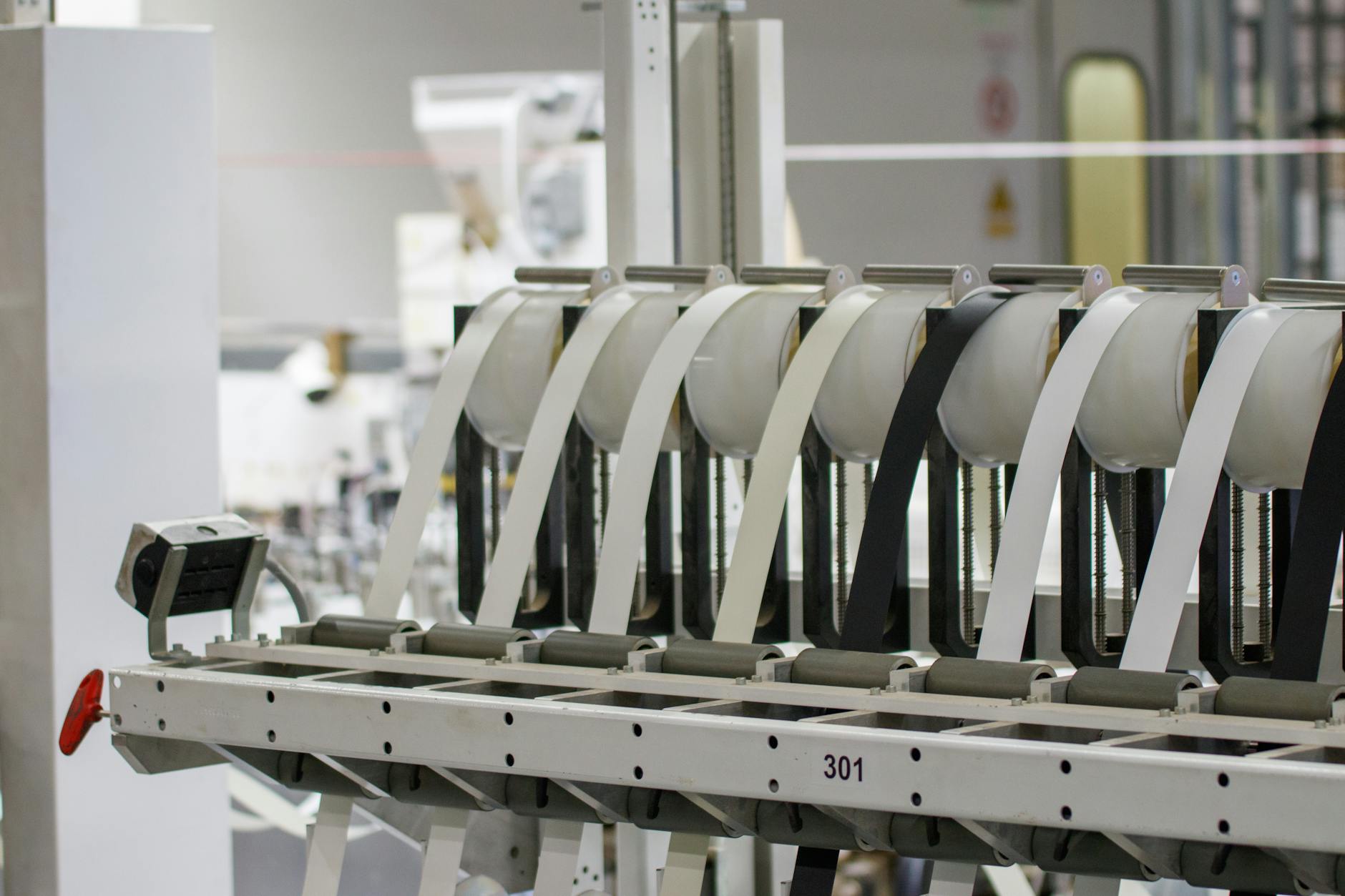 Modern industrial machine in operation in a manufacturing facility showcasing advanced technology.