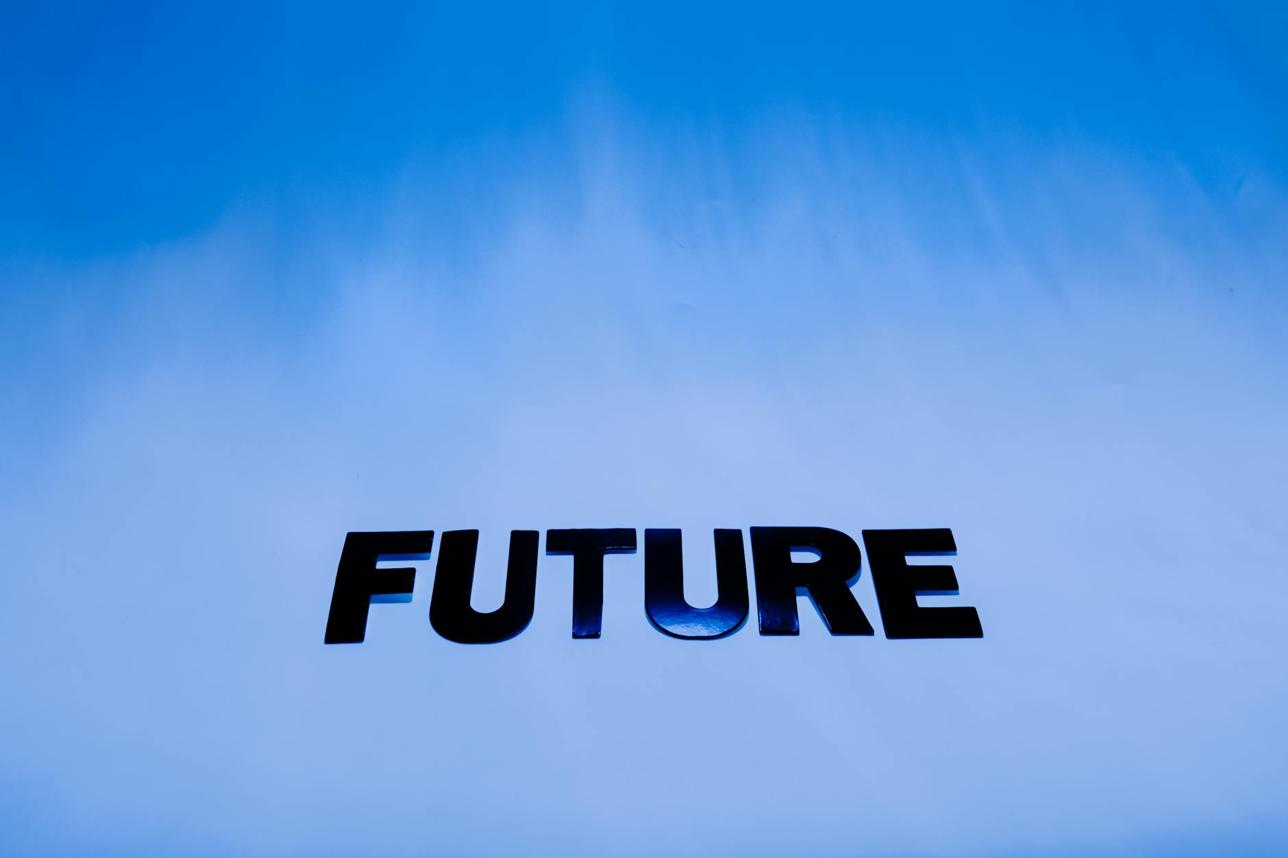 The word 'Future' in bold letters against a bright blue abstract background.