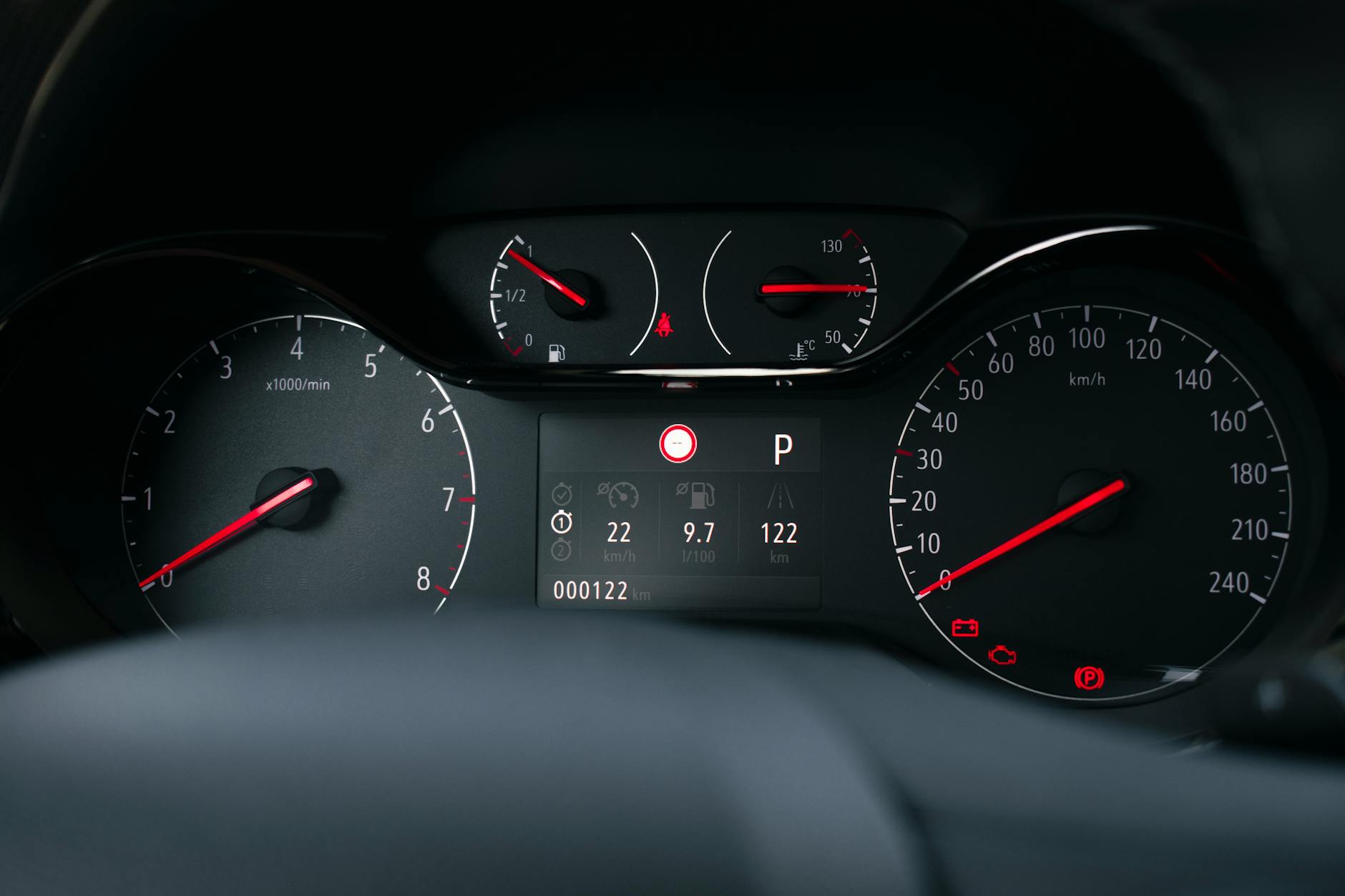 Detailed view of a modern car dashboard with speedometer and fuel gauge indicators.