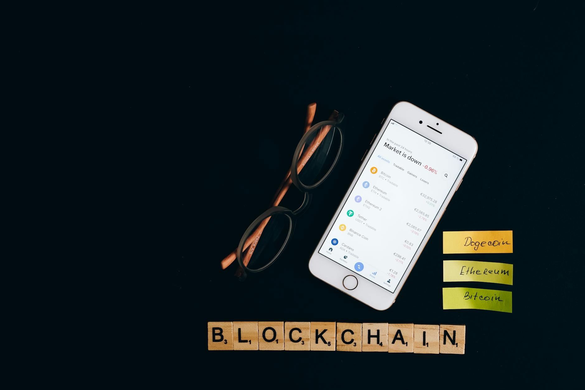 Smartphone displaying cryptocurrency market status with blockchain concept on black backdrop.