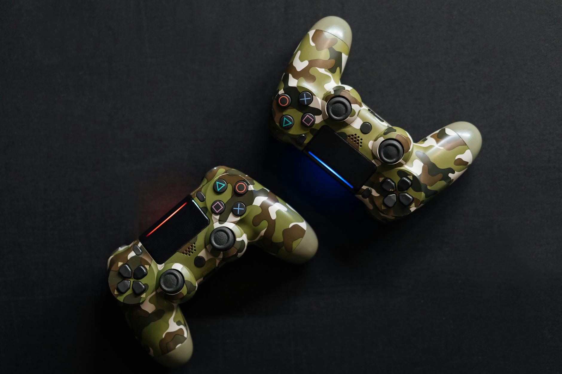 Close-up of two camouflage game controllers, perfect for gaming enthusiasts.