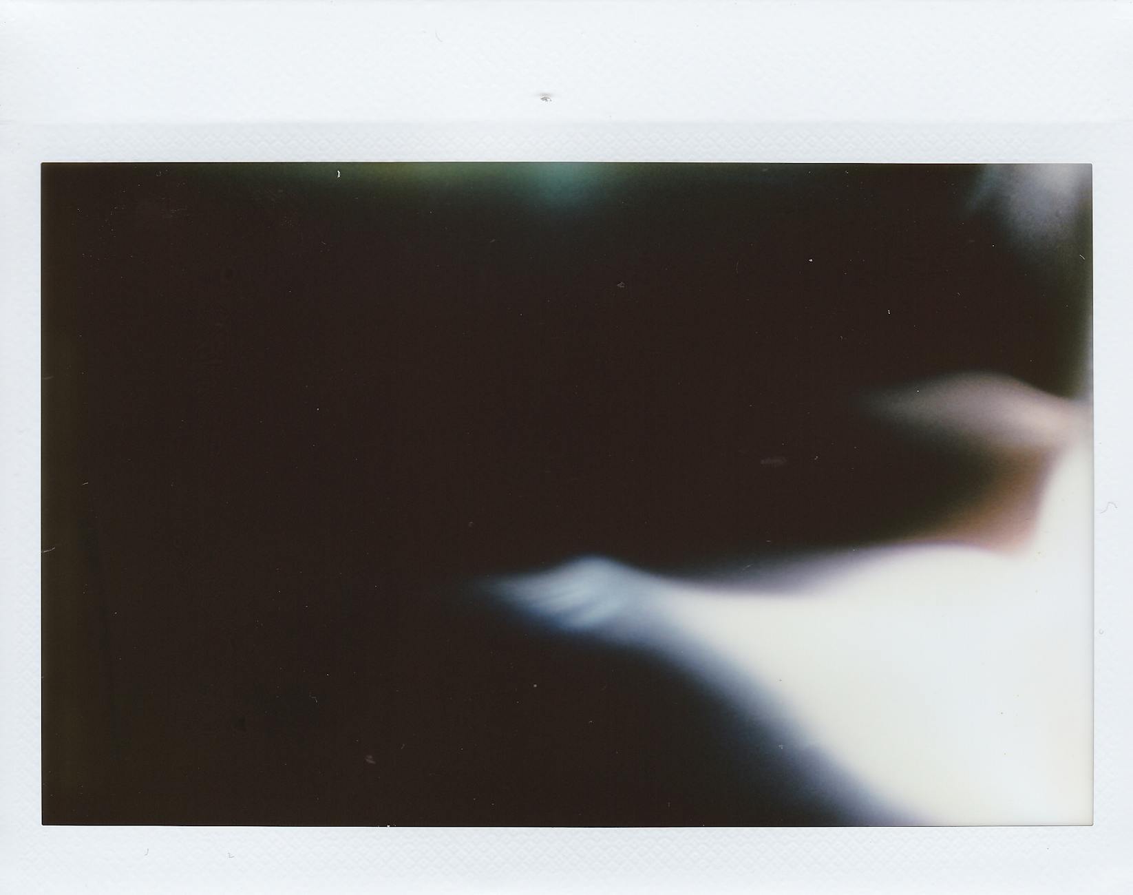 A blurred abstract image featuring soft dark tones and artistic style, ideal for backgrounds.