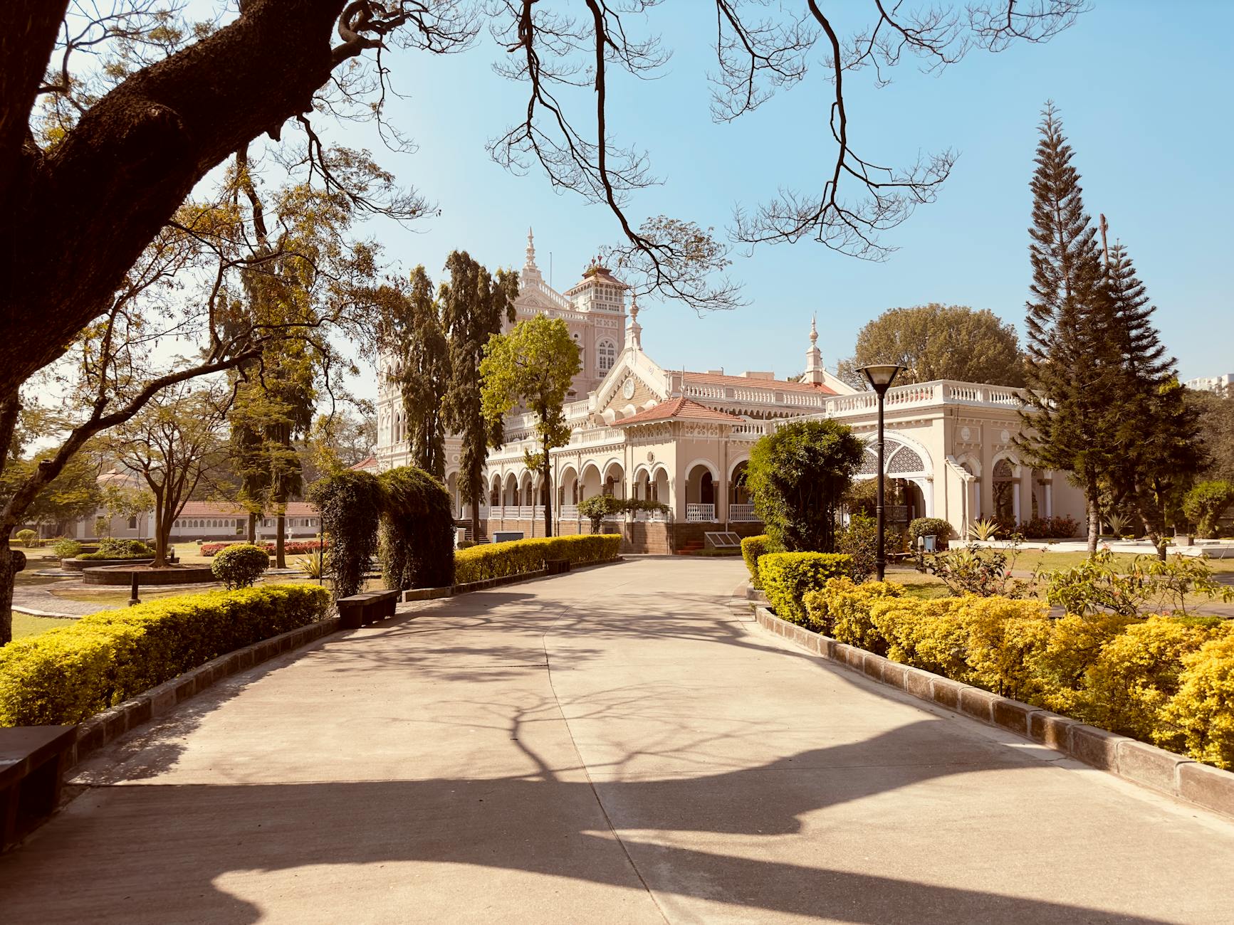 Beautiful palace surrounded by gardens in Pune, Maharashtra, India on a sunny day.