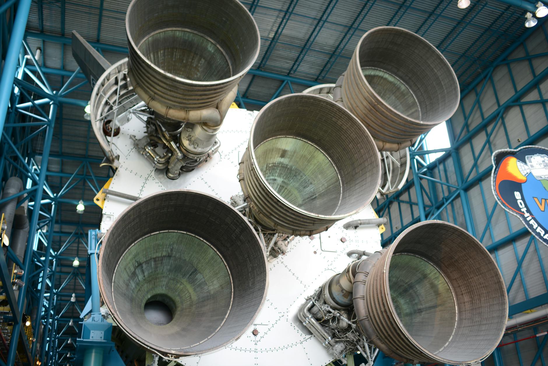 Close-up view of Saturn V rocket engines at Kennedy Space Center, highlighting intricate engineering.