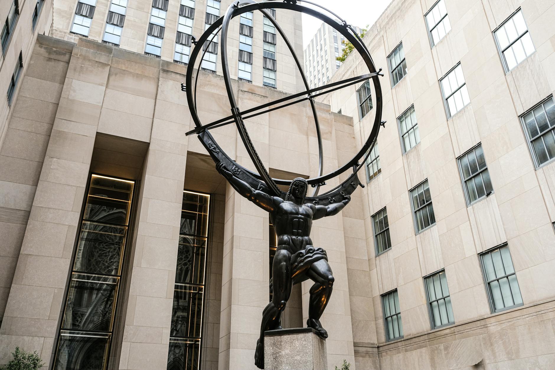 Iconic Atlas statue in Rockefeller Center, New York City, symbolizing strength and endurance.