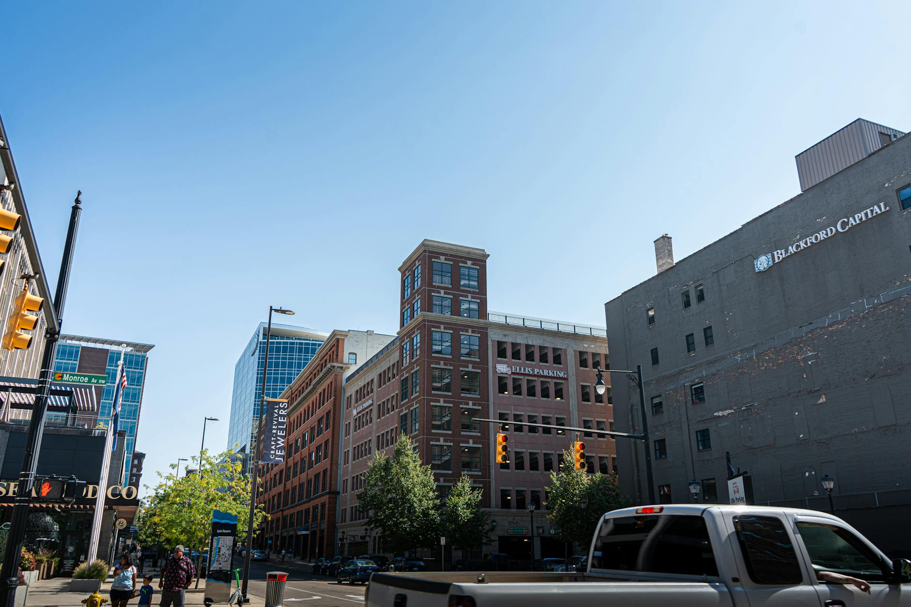 Vibrant urban street view of downtown Grand Rapids, showcasing city life and architecture.