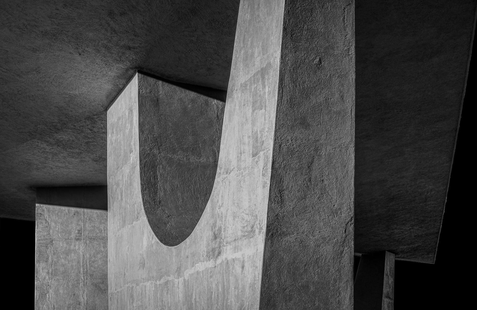 A striking black and white image of modern concrete architecture showcasing texture and design.